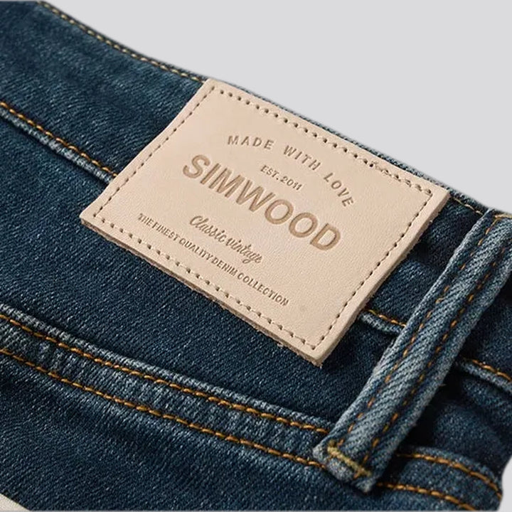 Mid-waist dark sanded men's jeans