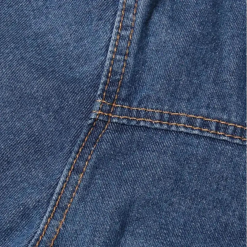 Cropped distressed women's denim jacket